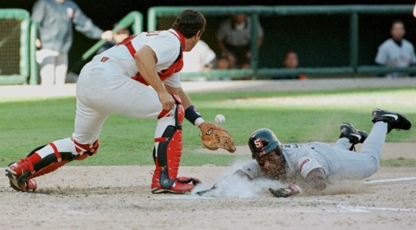 San Diego Padres Rickey Henderson (R) slides safely